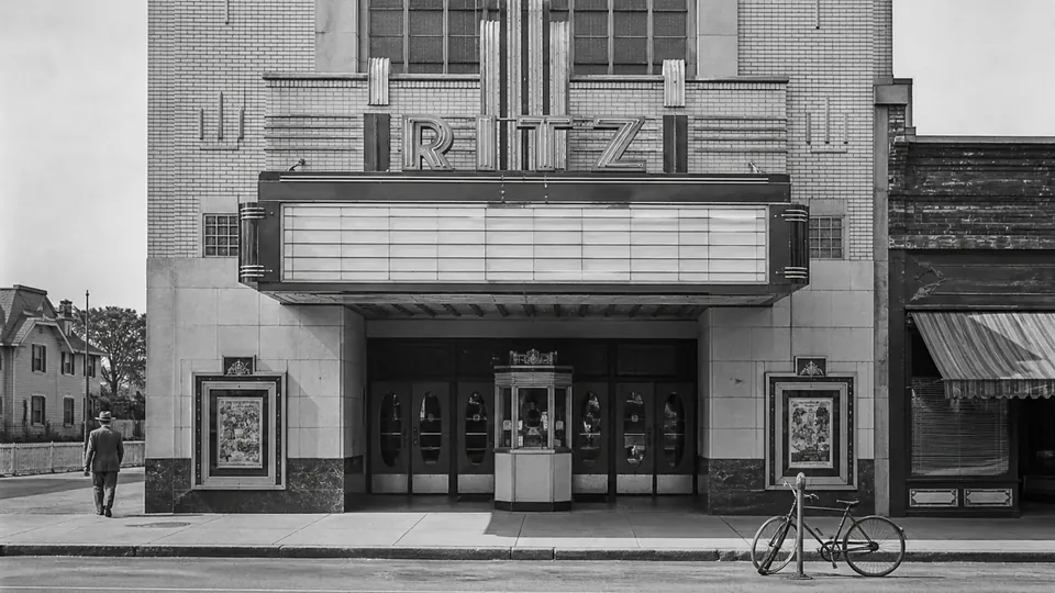 Same black-and-white cinema photograph fully repaired with its contents preserved